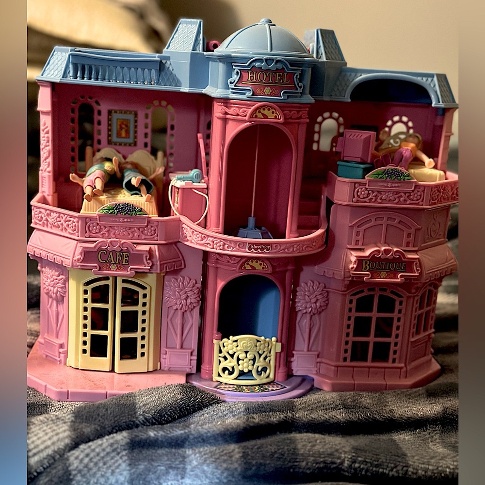 Vintage fisher price Sweet Streets hotel with a accessories and working elevator